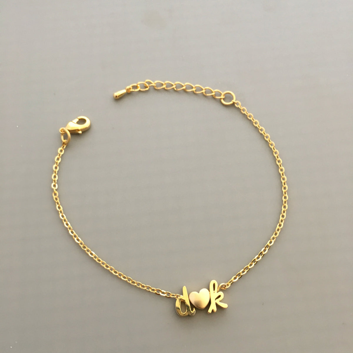 Dainty silver gold rose gold lowercase cursive script initial bracelet –  Gemnotic