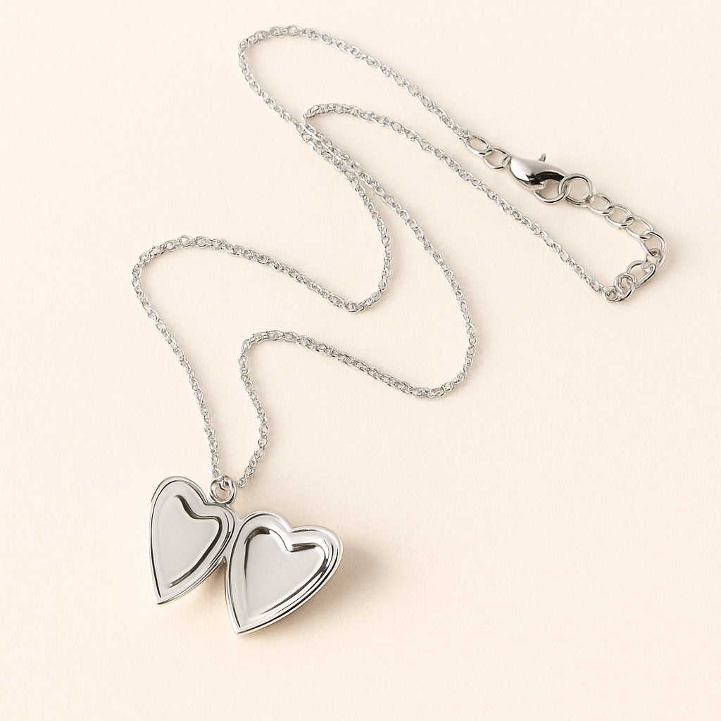 Silver necklace with heart-shaped pendants on a beige background
