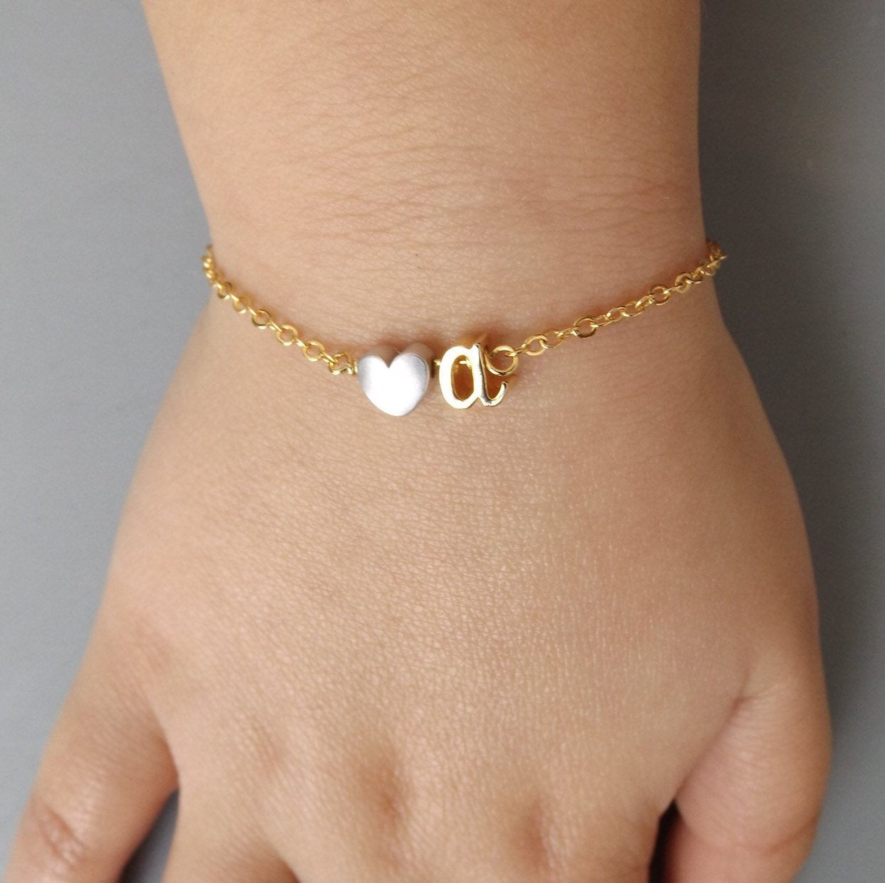 Dainty silver gold rose gold lowercase cursive script initial bracelet –  Gemnotic